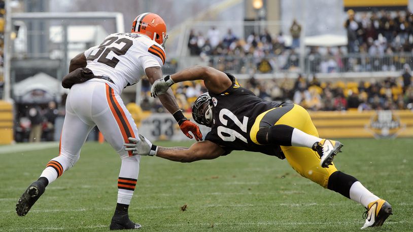 Cleveland Browns tight end Benjamin Watson (82) gets past Pittsburgh Steelers outside linebacker James Harrison (92) after maiking a catch in the first quarter of an NFL football game on Sunday, Dec. 30, 2012, in Pittsburgh. (AP Photo/Don Wright)