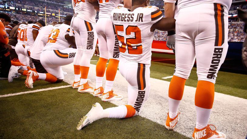 Members of the Cleveland Browns stand and kneel during the national anthem before the game against the Indianapolis Colts at Lucas Oil Stadium on September 24, 2017, in Indianapolis, Indiana. (Photo by Andy Lyons/Getty Images)