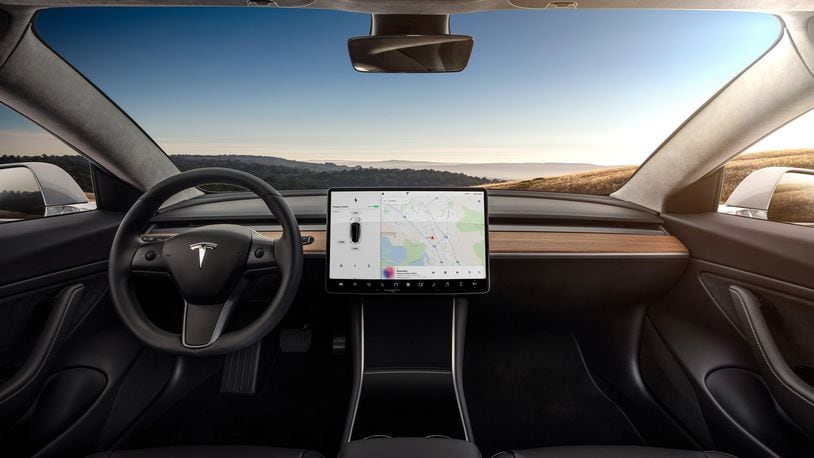 The Tesla Model 3 s minimalist interior with its 15-inch touchscreen as a focal point. Tesla Chief Executive Elon Musk says the next update to Tesla s operating system will include classic video games from Atari. (Tesla)