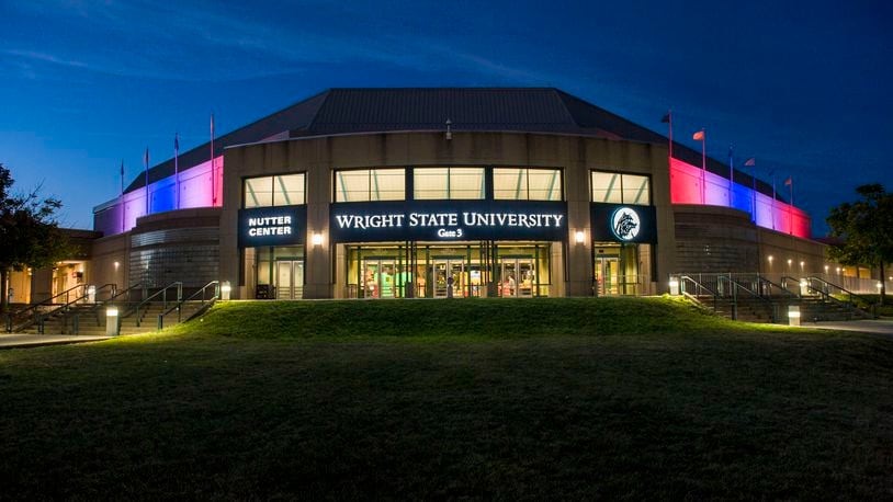 Red, white and blue lights illuminate Wright State University’s Nutter Center in honor of its selection Sept. 23, 2015, as the site of the first presidential debate on Sept. 26, 2016. (Jim Noelker/Staff)