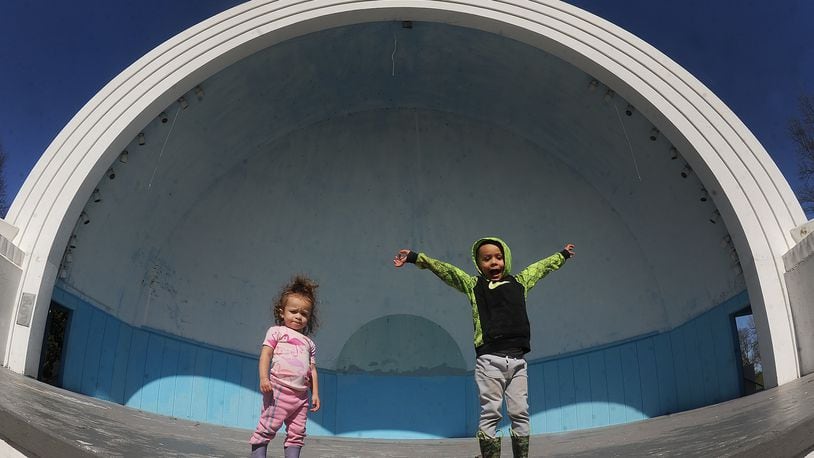One-year-old Bellamy, left, and her brother, 4-year-old Brandon Vaughen, play inside the Island MetroPark bandshell Monday, March 11, 2024, during a family walk. MARSHALL GORBY\STAFF