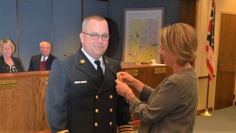 Washington Twp. swore-in a new fire chief Monday night as Deputy Chief Scott Kujawa had his new badge pinned on by his wife Jenny.