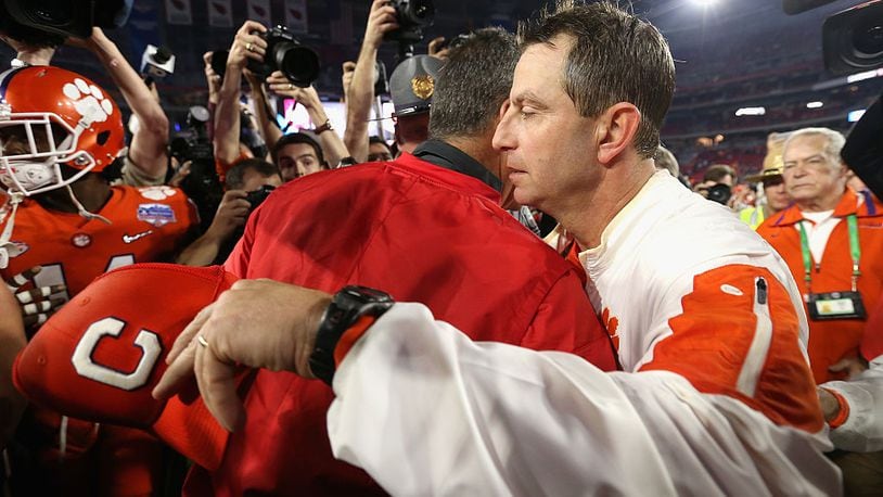 GLENDALE, AZ - DECEMBER 31:  Head coach Dabo Swinney of the Clemson Tigers greets head coach Urban Meyer of the Ohio State Buckeyes after the Clemson Tigers defeated the Ohio State Buckeyes 31-0 to win the 2016 PlayStation Fiesta Bowl at University of Phoenix Stadium on December 31, 2016 in Glendale, Arizona.  (Photo by Christian Petersen/Getty Images)