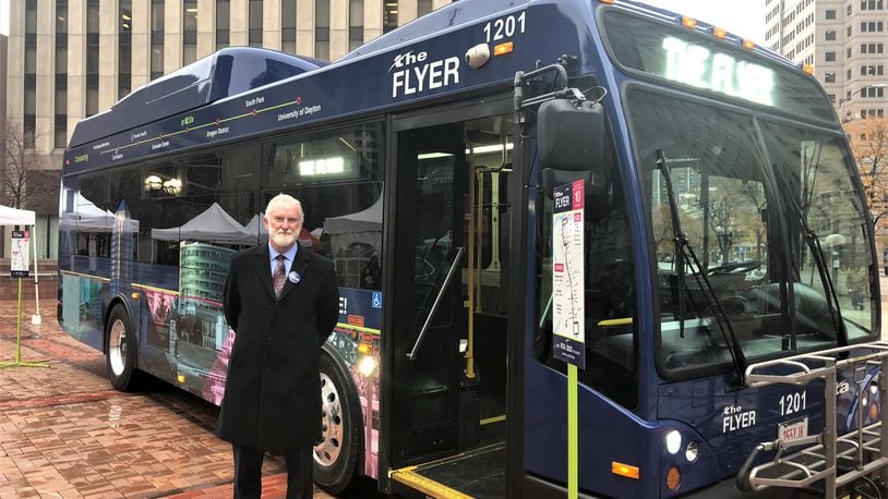 Mark Donaghy, Greater Dayton RTA CEO, stands next to the Flyer, a downtown shuttle bus free for riders. CORNELIUS FROLIK / STAFF