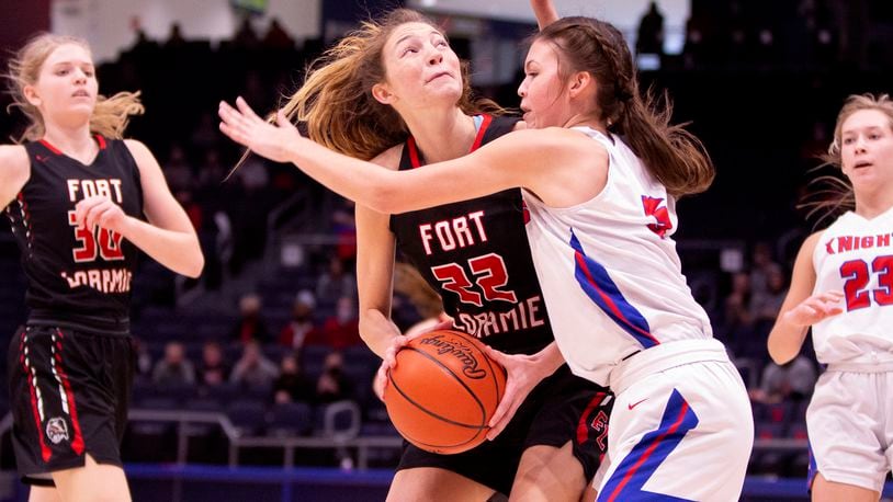 Fort Loramie's Kenzie Hoelscher works to score inside against Convoy Crestview's Cali Gregory during Thursday's Division IV state semifinal at UD Arena. Loramie won 66-24 and Hoelscher scored 12 points. Jeff Gilbert/CONTRIBUTED