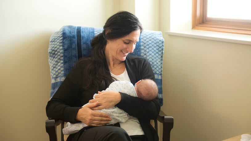 Shelly Decker, a nurse for Brigid's Path, holds one of the babies the agency serves. Kettering-based Brigid's Path serves newborns and mothers impacted by addiction.