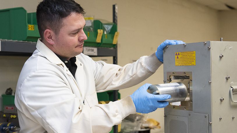 Seth Walton removes a part containing radioactive material that will be properly recycled or disposed of by the Air Force Radioactive Recycling and Disposal team Dec. 1, 2021, at Wright-Patterson Air Force Base. Air Force Radioactive Recycling and Disposal is the primary focal point for radioactive recycling and waste management within the Air Force. U.S. AIR FORCE PHOTO/JAIMA FOGG
