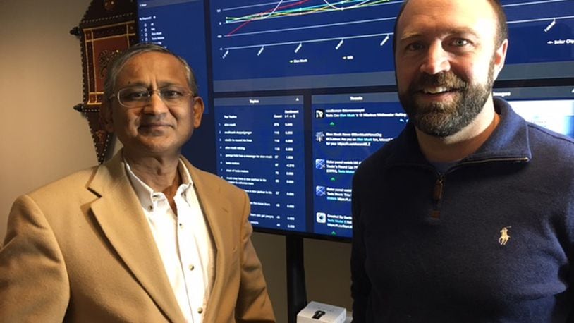 Amit Sheth, left, and James Mainord, co-founders of Cognovi Labs, are commercializing a technology that pulls predictive insights from Twitter and other social media havens. THOMAS GNAU/STAFF