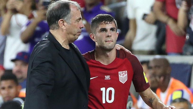 USA head coach Bruce Arena puts his arm around player Christian Pulisic (10) during action against Panama during World Cup qualifier match at Orlando City Stadium on Friday, Oct. 6, 2017, in Orlando, Fla. (Stephen M. Dowell/Orlando Sentinel/TNS)