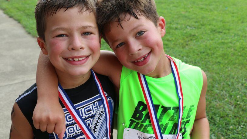 Twins Max and Josh Harker last year at the Lebanon Countryside YMCA triathlon. This year will be their fourth year participating. CONTRIBUTED