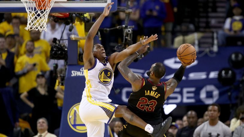 OAKLAND, CA - MAY 31:  LeBron James #23 of the Cleveland Cavaliers shoots a layup defended by Kevon Looney #5 of the Golden State Warriors in Game 1 of the 2018 NBA Finals at ORACLE Arena on May 31, 2018 in Oakland, California. NOTE TO USER: User expressly acknowledges and agrees that, by downloading and or using this photograph, User is consenting to the terms and conditions of the Getty Images License Agreement.  (Photo by Ezra Shaw/Getty Images)