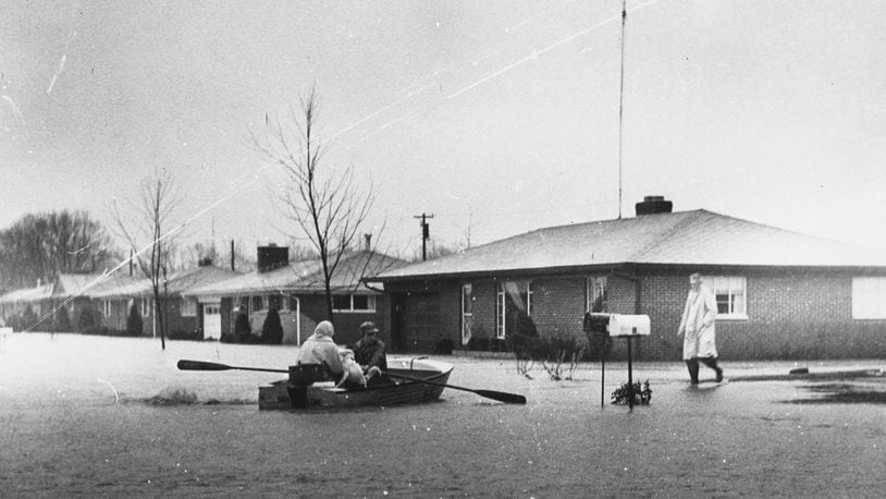 As much as 5.6 inches of rain ran off frozen ground in January 1959 and caused localized flooding, which forced evacuations, closed schools, destroyed property and took at least two area lives, according to Dayton Daily News accounts from the time. During that time, the five Miami Conservancy District dams held back the largest amount of water since they were completed in 1922, preventing a greater catastrophe like the Great Flood of 1913. Pictured here is a scene on Minty Avenue. DAYTON DAILY NEWS ARCHIVE, WRIGHT STATE UNIVERSITY LIBRARIES' SPECIAL COLLECTIONS & ARCHIVES 