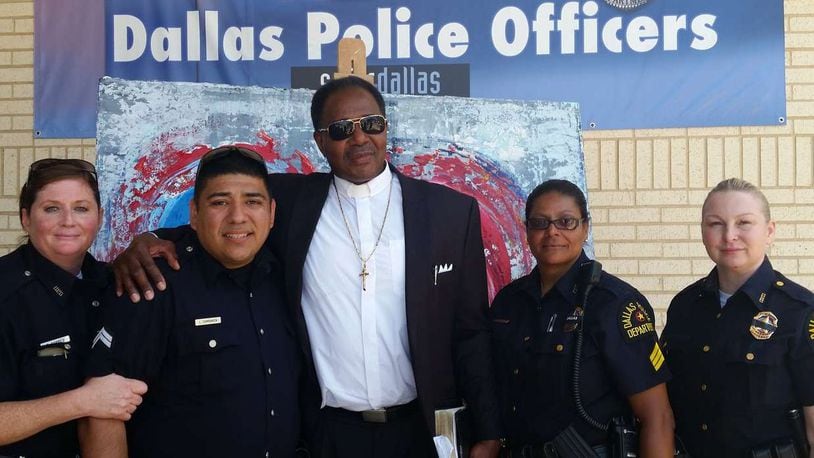 The Rev. J.D. Grigsby with Dallas police offers earlier this month. CONTRIBUTED PHOTO