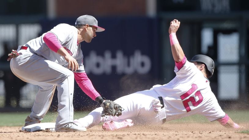 The Giants’ Joe Panik (12) steals second base ahead of the tag from Reds second baseman Jose Peraza in the eighth inning at AT&T Park in San Francisco on Saturday, May 13, 2017. (Jim Gensheimer/Bay Area News Group/TNS)