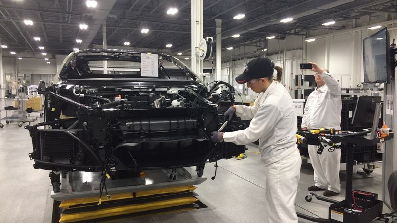 A worker at the Performance Manufacturing Center in Marysville, Ohio assembles the 2017 Acura NSX. KATHERINE COLLINS/STAFF