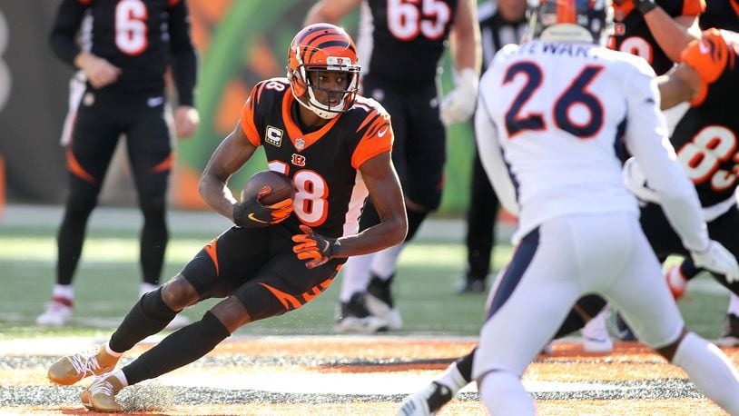 CINCINNATI, OH - DECEMBER 2: A.J. Green #18 of the Cincinnati Bengals runs with the ball during the first quarter of the game against the Denver Broncos at Paul Brown Stadium on December 2, 2018 in Cincinnati, Ohio. (Photo by John Grieshop/Getty Images)