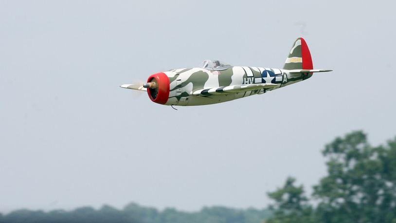 A large scale remote control replica of a vintage war plane makes a low level pass over the runway during the Miami Valley Radio Control club’s large scale fly-in at Hook Field in Middletown, Ohio Saturday Aug. 8, 2009. The club lost its headquarters off Ohio 741 to the Warren County Sports Park at Union Village. Staff photo by Pat Auckerman