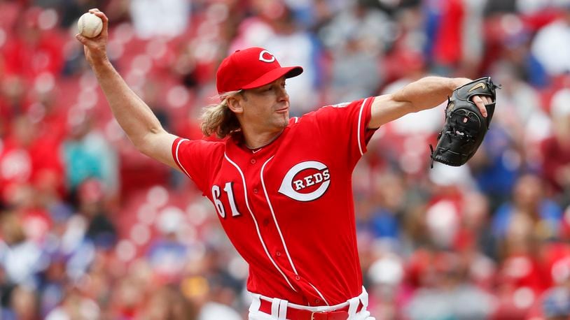 Cincinnati Reds starting pitcher Bronson Arroyo throws in the first inning of a baseball game against the Chicago Cubs, Sunday, April 23, 2017, in Cincinnati. (AP Photo/John Minchillo)