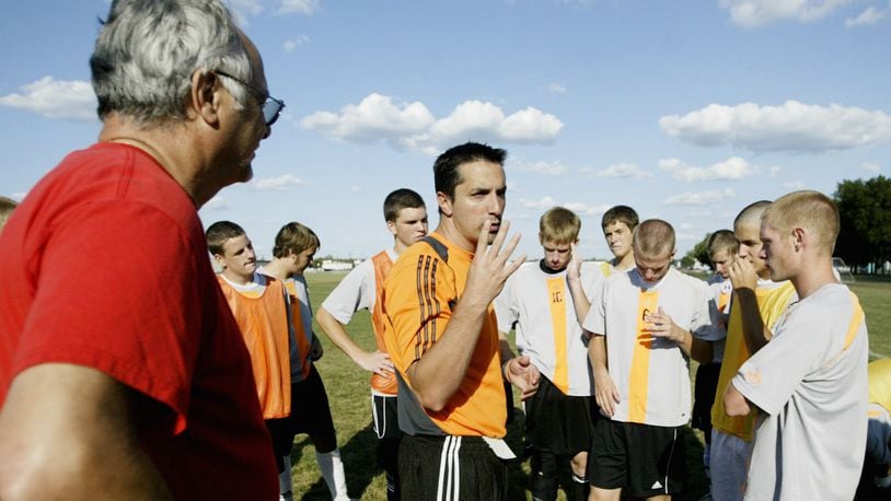 John Guiliano (left) and his son Jason Guiliano (middle) have been a Beavercreek coaching team the last 19 seasons. FILE