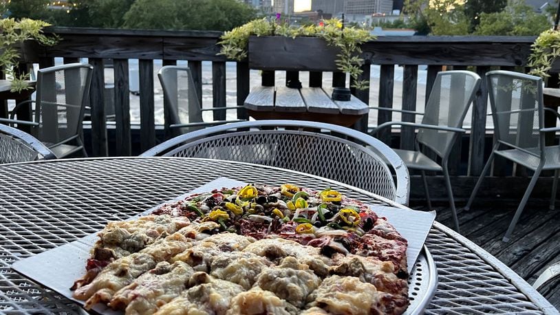 View from the patio at the Oregon Express with a Rueben pizza. PHOTO BY ALEXIS LARSEN