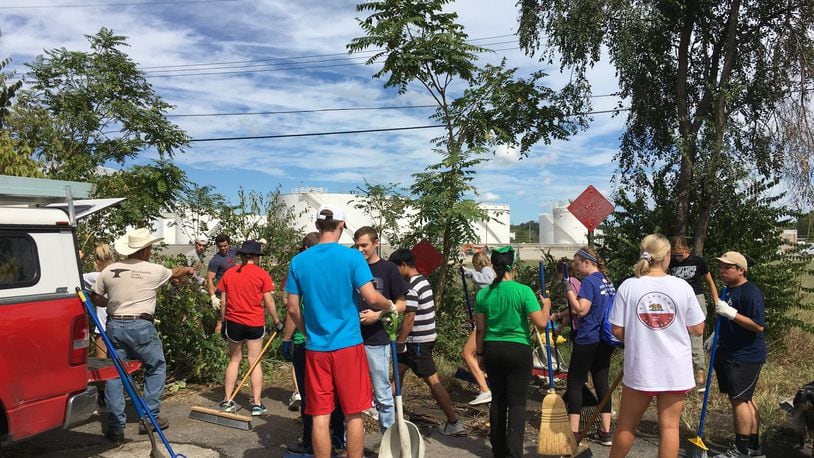 More than 100 University of Dayton student volunteers and 150 total volunteers worked Saturday in Old North Dayton near Valley Street to continue cleanup efforts following the Memorial Day tornadoes. STAFF PHOTO / SARAH FRANKS