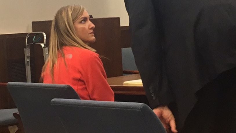 Ex-Miamisburg Middle School teacher Jessica Langford, 32, of Centerville, is on trial on charges alleging she had sexual contact with the student, who was 14. Langford is talking with her attorney Lawrence Greger. MIKE CAMPBELL/STAFF