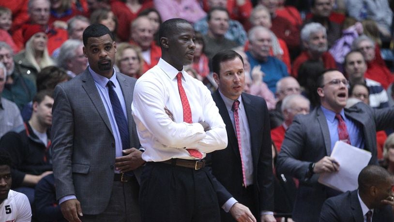 Dayton coaches Ricardo Greer, Anthony Grant, James Kane and Andy Farrell watch the action during a game against Georgia State on Saturday, Dec. 16, 2017, at UD Arena. David Jablonski/Staff