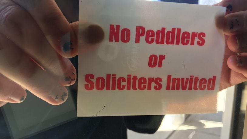 As spring nears, area leaders are expecting solicitors to come into their communities. Miamisburg provides residents these no soliciting stickers. STAFF PHOTO / MAX FILBY