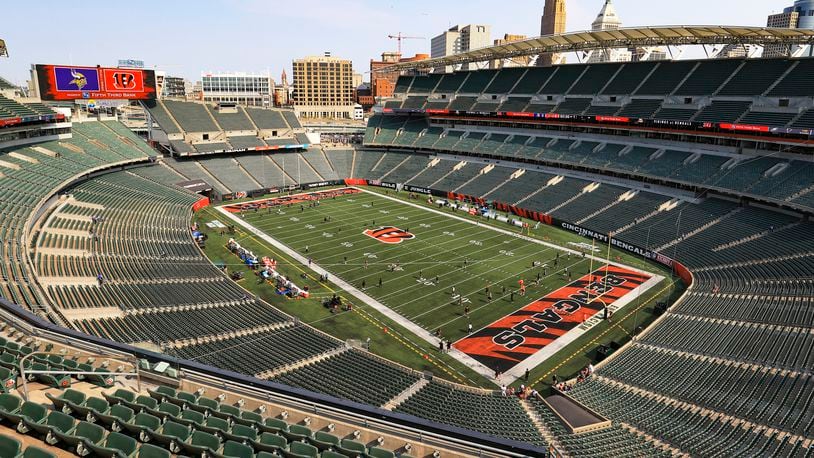 The electronic display shows the team logos over the empty Paul Brown Stadium before an NFL football game between the Cincinnati Bengals and the Minnesota Vikings, Sunday, Sept. 12, 2021, in Cincinnati. (AP Photo/Aaron Doster)