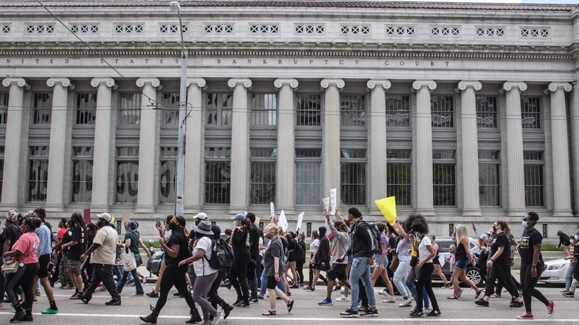 A protest event that began at the federal building in downtown Dayton on Saturday, May 30, 2020, moved to the area of Jones Street and Wayne Avenue, where police stopped marchers from entering U.S. 35 by using pepper spray balls and a line of officers. MARSHALL GORBY / STAFF