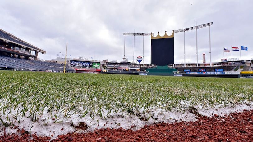 Snow clings to the edge of the grass following overnight flurries before a game between the Kansas City Royals and Los Angeles Angels on Sunday, April 15, 2018, at Kauffman Stadium in Kansas City, Mo. The game was postponed because of cold weather. (John Sleezer/Kansas City Star/TNS)