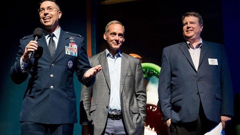 Col. Thomas Sherman (left), 88th Air Base Wing and installation commander at Wright-Patterson Air Force Base, Jeff Hoagland (center), president and CEO of Dayton Development Coalition, and Ty Sutton, CEO of Victoria Theatre Association, give opening remarks Nov. 20 at the SpongeBob Musical performance at the Benjamin & Marian Schuster Performing Arts Center in downtown Dayton. (Contributed photo)