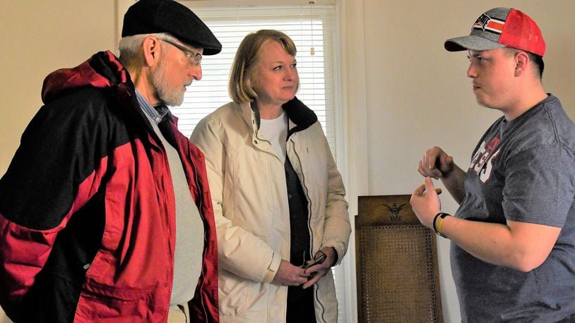 Reed and Donna Sevitts talk with Matthew Ruemping (right), case manager for the Troy Joshua Recovery Ministries. CONTRIBUTED