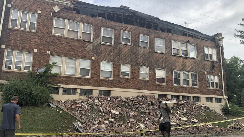 The facade of an apartment building on the 1100 block of Salem Avenue came tumbling down on Monday. CORNELIUS FROLIK / STAFF