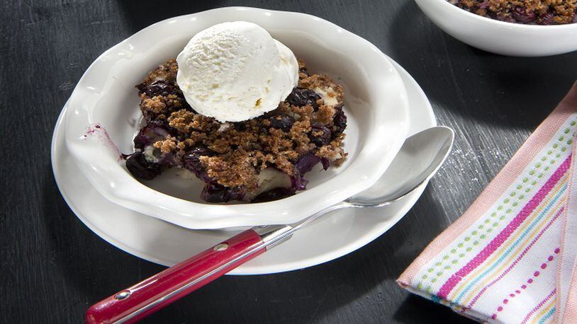 Try Lemon Blueberry Brown Betty topped with a scoop of frozen nonfat yogurt ice. (Tammy Ljungblad/Kansas City Star/TNS)