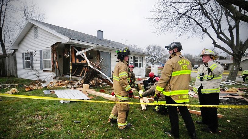 One person was injured after a vehicle crashed into a Foley Drive house in Vandalia Friday, Jan. 13, 2023. MARSHALL GORBY / STAFF