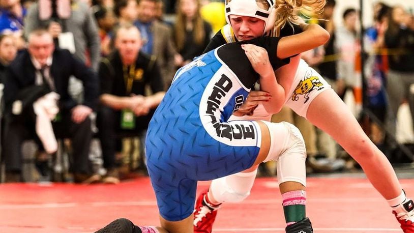 Sidney s Josie Davis (white singlet) will go for her third title at the Ohio High School Wrestling Coaches Association girls state wrestling championships this weekend at Hilliard Davidson High School. Kevin Bowyer Photography / Contributed