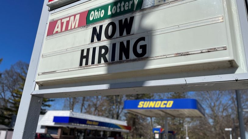 A now hiring sign at a Sunoco in Dayton. The Dayton region saw a big increase in hiring in January. CORNELIUS FROLIK / STAFF