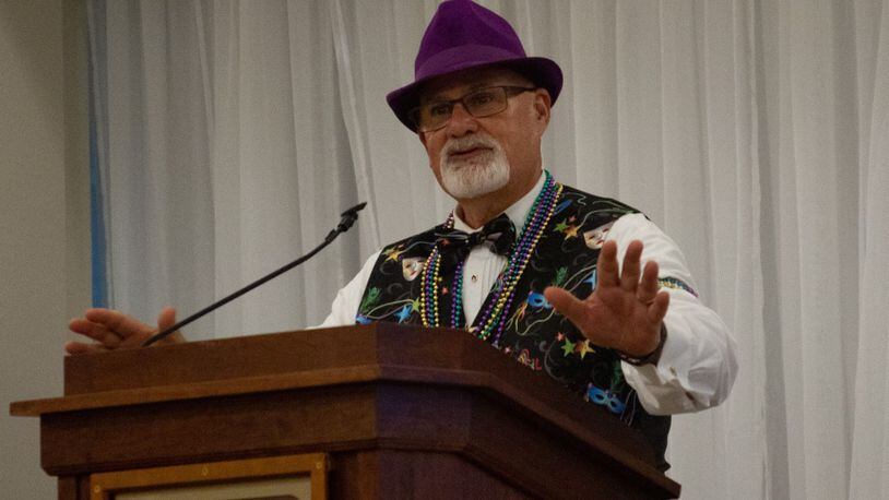 Chris Stanley, executive director of the Fisher-Nightengale Houses, at the "Beads and Bling – It’s a Mardi Gras Thing” fundraiser in August at the Dayton Masonic Center. Contributed