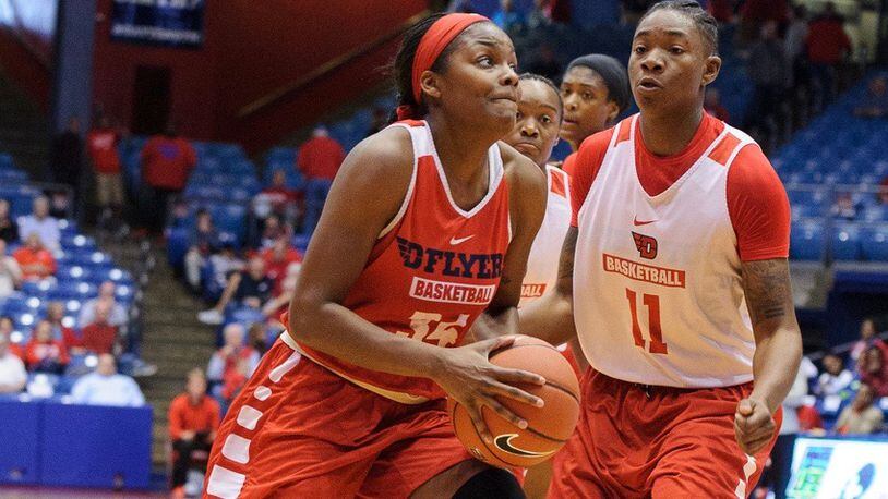 Junior guard JaVonna Layfield dribbles by Alex Harris during Dayton’s Red and Blue Game on Saturday, Oct. 22 at U.D. Arena. Contributed Photo by Bryant Billing