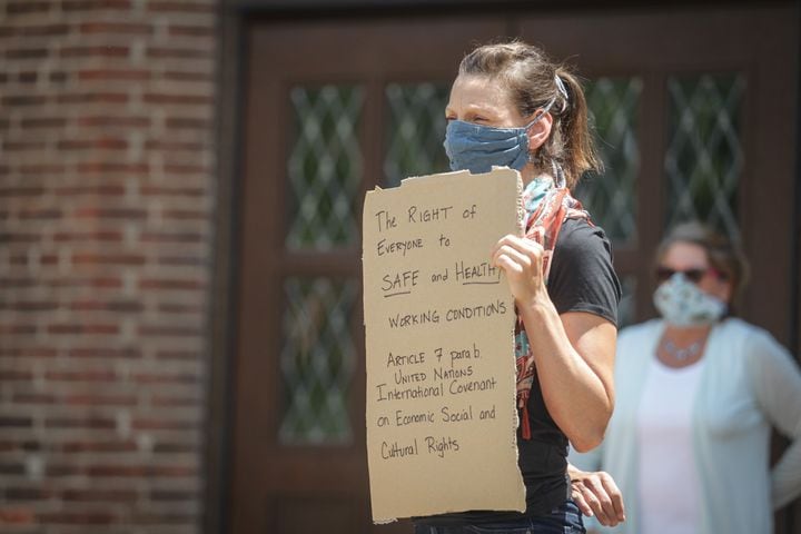 PHOTOS: Professors at the University of Dayton hold demonstration about school opening