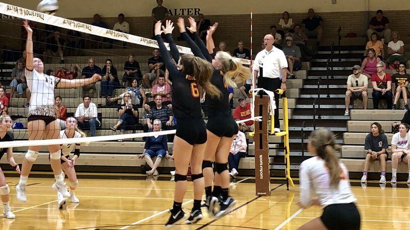 Fenwick’s Grace Dinkelaker (6) is among the players at the net waiting for an Alter spike during Thursday night’s match in Kettering. Fenwick posted a 3-2 victory. CONTRIBUTED PHOTO BY DEBBIE JUNIEWICZ