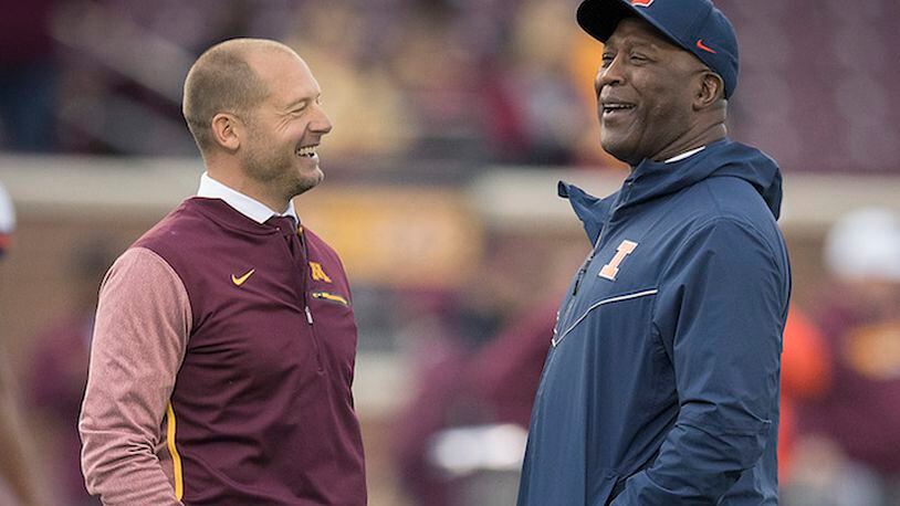 Minnesota head coach P.J. Fleck, left, and Illinois head coach Lovie Smith chat on the field before the start of play at TCF Bank Stadium in Minneapolis on October 21, 2017. (Elizabeth Flores/Minneapolis Star Tribune/TNS)