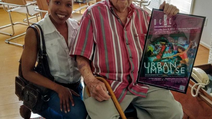 In celebration of Clayton resident Harold Prigozen’s 100th birthday May 14, dancer Sheri “Sparkle” Williams gave him a concert poster signed by DCDC dancers.