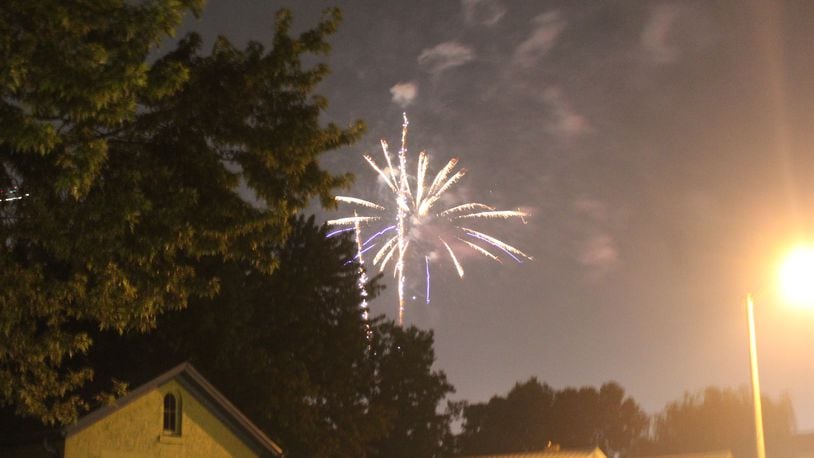 Fireworks go off in a city of Dayton neighborhood on Sunday, July 4, 2021. Cornelius Frolik / Staff