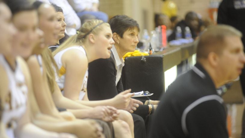 Chris Hart (middle) and Kendel Peck (front) have been unique co-head coaches of the Alter girls basketball program for 15 seasons. MARC PENDLETON / STAFF