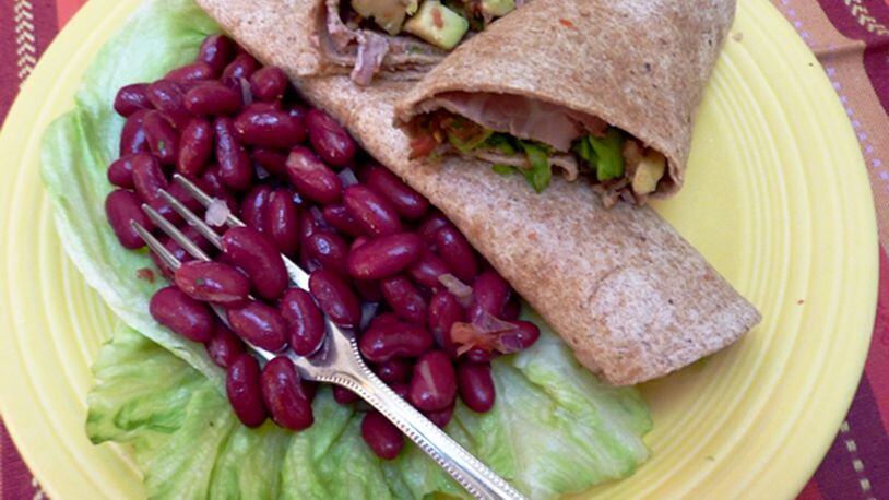 Avocado and roast beef wrapped in a flour tortilla create a simple dinner. No need to turn on the stove for this wrap and salad. (Linda Gassenheimer/TNS)