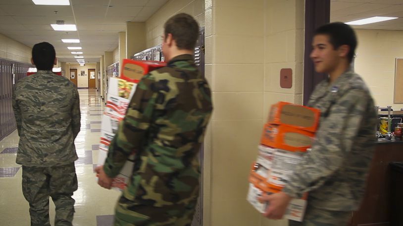 Junior ROTC students work on a food drive at a local school. STAFF FILE PHOTO