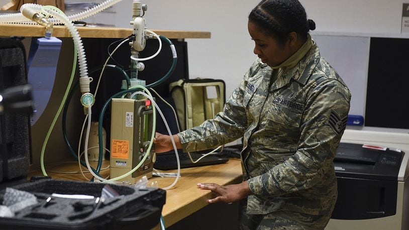 Staff Sgt. Neekia Williams, 52nd Medical Group biomedical equipment technician, inspects a ventilator at Spangdahlem Air Base, Germany, April 1. Williams ensures ventilators are working properly if needed for COVID-19 care. (U.S. Air Force photo/Senior Airman Melody W. Howley)