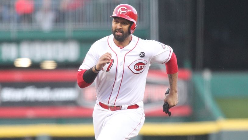 The Reds Matt Kemp runs to third base against the Marlins on Tuesday, April 9, 2019, at Great American Ball Park in Cincinnati. David Jablonski/Staff